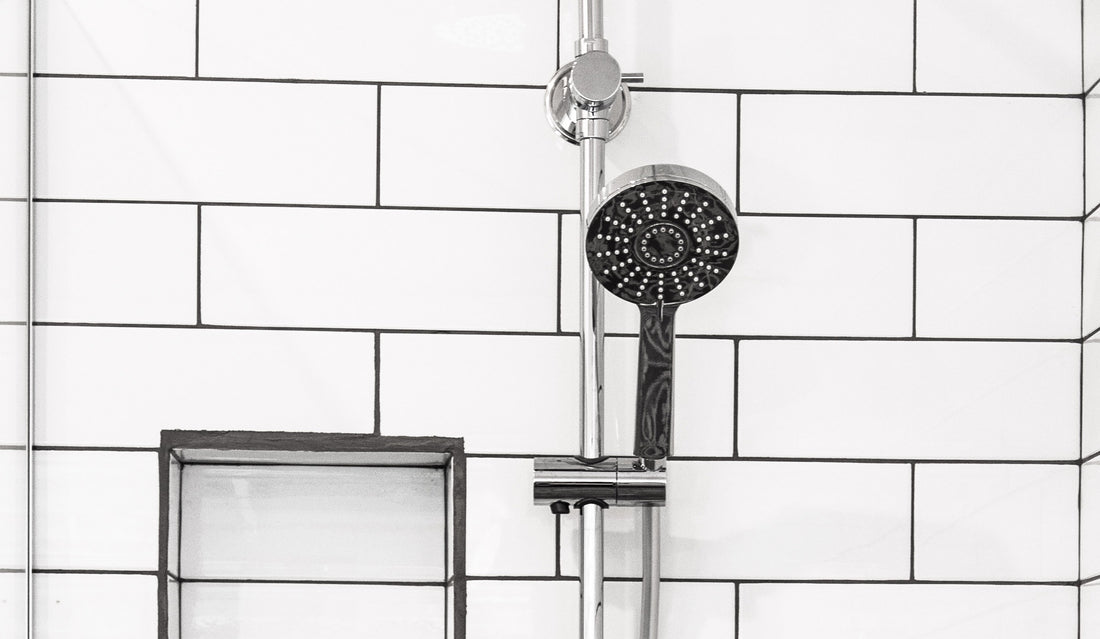 Silver Smart Shower Head In A White Wall